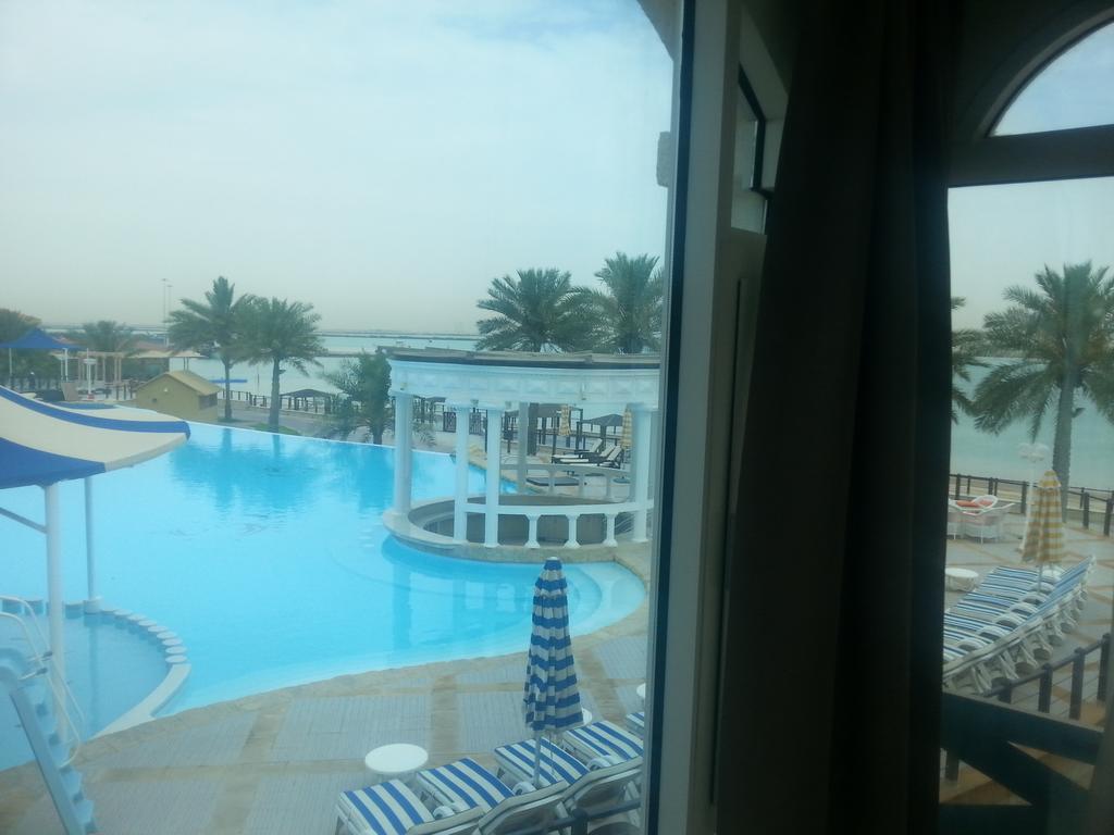 Tio Sea Resort Аль-Хор Экстерьер фото View of the pool at the Al Khobar Hilton